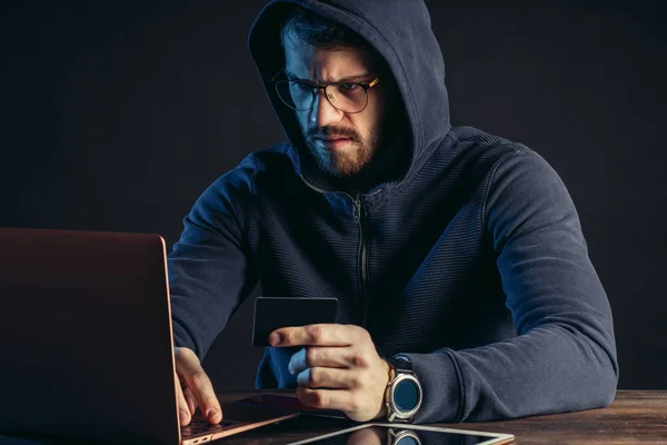 hacker man, computer genius engaged in crime