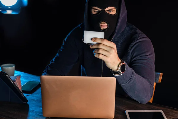hacker man, computer genius engaged in crime