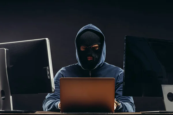 Young hacker in balaclava — Stock Photo, Image