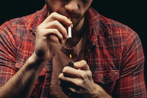 Cropped male holding cigarette and lighter in hands — Stock Photo, Image