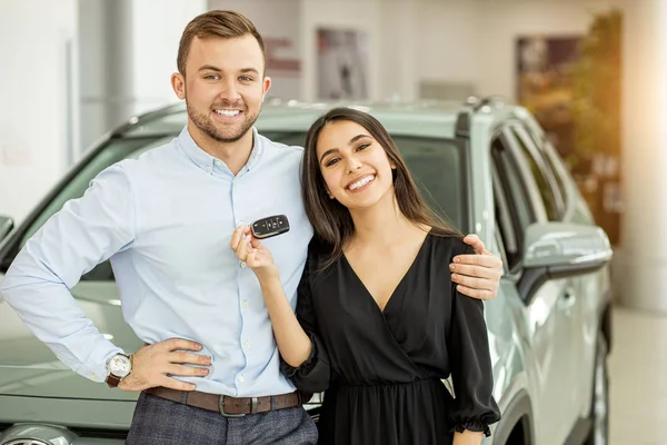 happy married couple buy new car