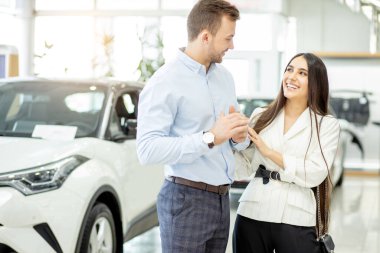 surprised lady surprisingly look at man, celebration of car purchase