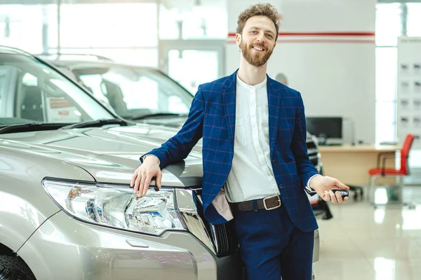 positive smiling man happy after successful purchase of car