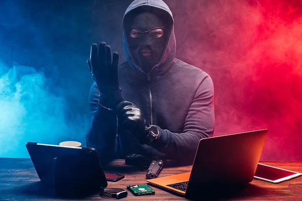 young hacker bandit engaged in crime