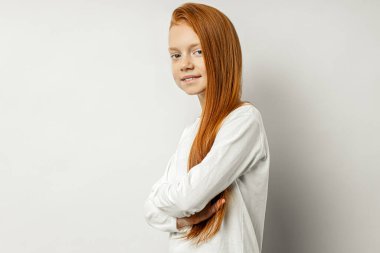 portrait of redhead girl isolated over white background