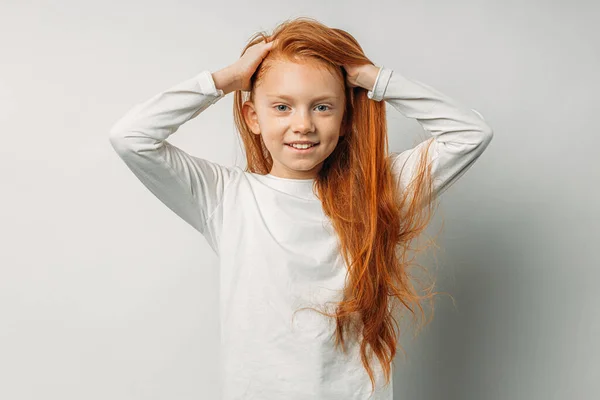 Happy caucasian kid with red hair isolated over white background — 스톡 사진