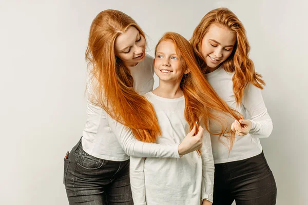 Cute caucasian sisters with red hair isolated — Stockfoto