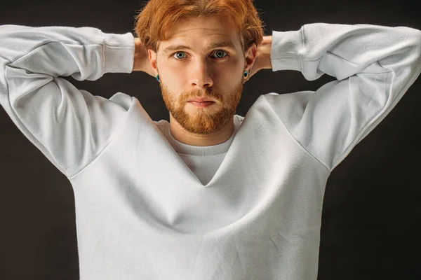 Serious caucasian bearded redhead man posing at camera isolated — Stock Fotó