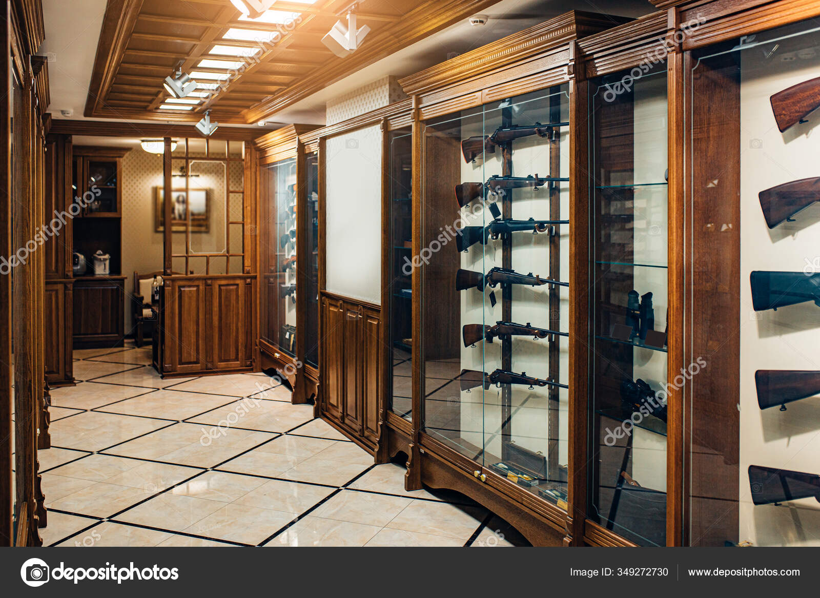 Modern gun store interior with different rifles on showcase Stock Photo by  ©romanchazov27 349272730