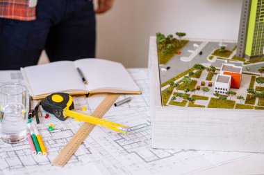 close-up of man work using drawings in office