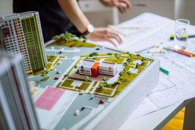 close-up of man work using drawings in office