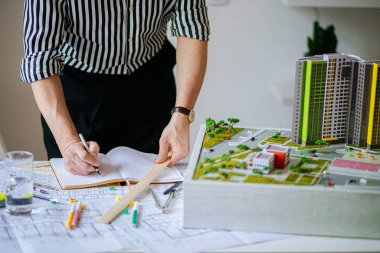close-up of man work using drawings in office
