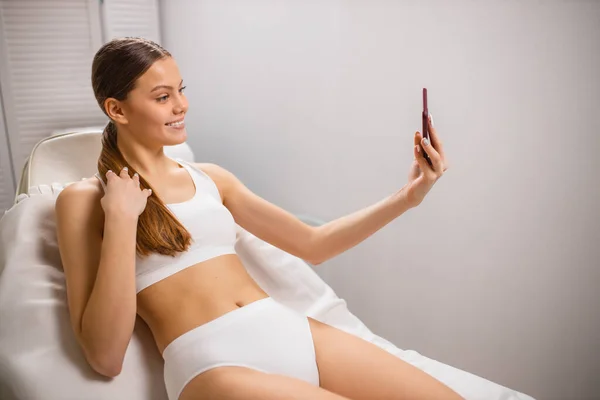 Gorgeous lady take selfie before laser epilation procedure — Stock Photo, Image