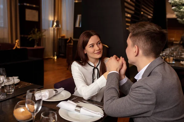 caucasian couple celebrate anniversary in restaurant