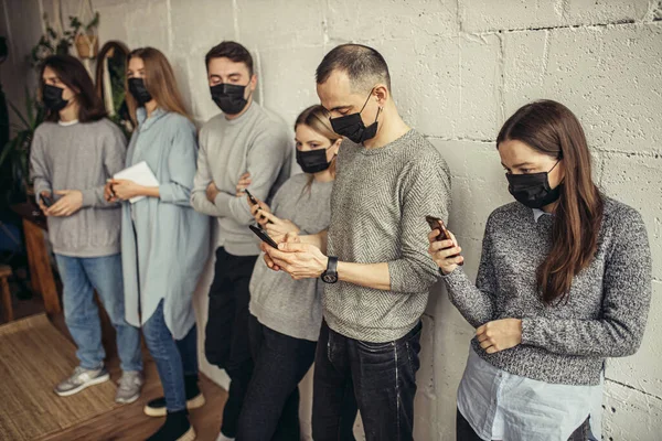 ill young people in line for a doctors appointment