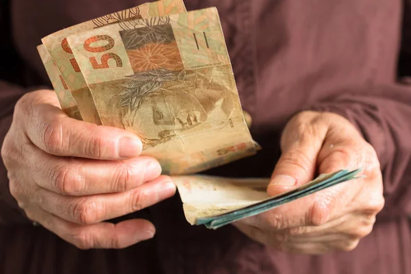 Brazilian Currency Reais Front View Senior Person Holding Bills — 스톡 사진