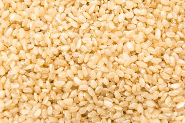 Oryza sativa, tüm Short Grain Rice Seed 'in bilimsel adıdır. Sushi Rice ve Arroz Cateto Integral (Portekizce) olarak da bilinir. Tahılların kapatılması, arkaplan kullanımı.