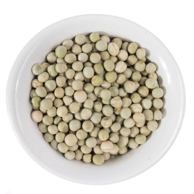 Pisum sativum, Bezelyenin bilimsel adıdır. Ayrıca Ervilha (Portekizce), Chicharo ve Arveja (İspanyolca) olarak da bilinir. Seramik kasesindeki tahılların en üst görüntüsü.