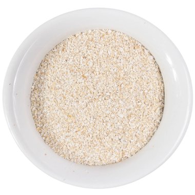 Avena Sativa, Yulaf gevreğinin bilimsel adıdır. Aveia ya da Avena olarak da bilinir. Seramik kasesindeki tahılların en üst görüntüsü. İzole edilmiş.