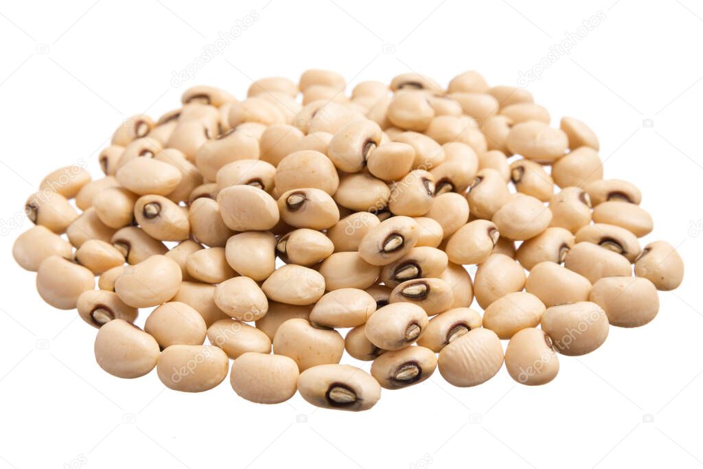 Vigna unguiculata is scientific name of Black Eyed Pea legume. Also known as Goat Pea, California Blackeye and Feijao Fradinho. Pile of grains, isolated white background.