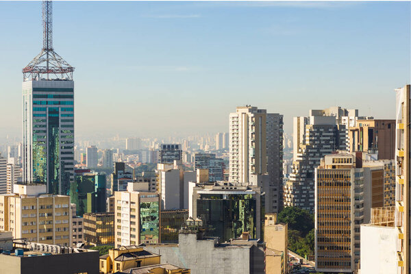 Aerial view of Sao Paulo city, Brazil. Brazilian financial and commercial center. Modern buildings and blue sky.