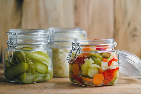 Pickled vegetables in glass jars