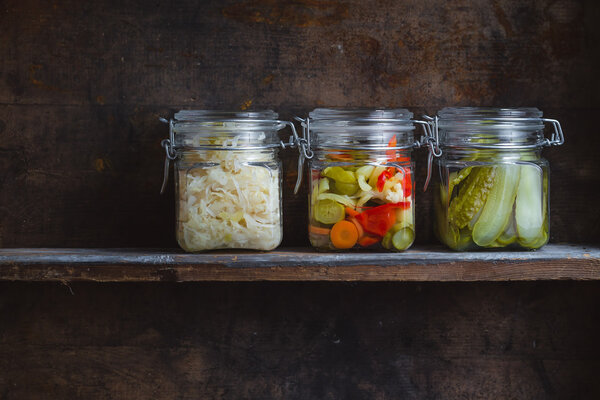 Pickled vegetables in glass jars