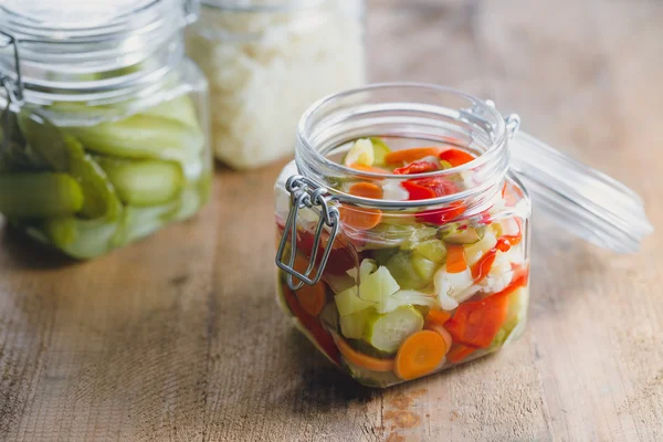 Pickled vegetables in glass jars — Stock Photo, Image