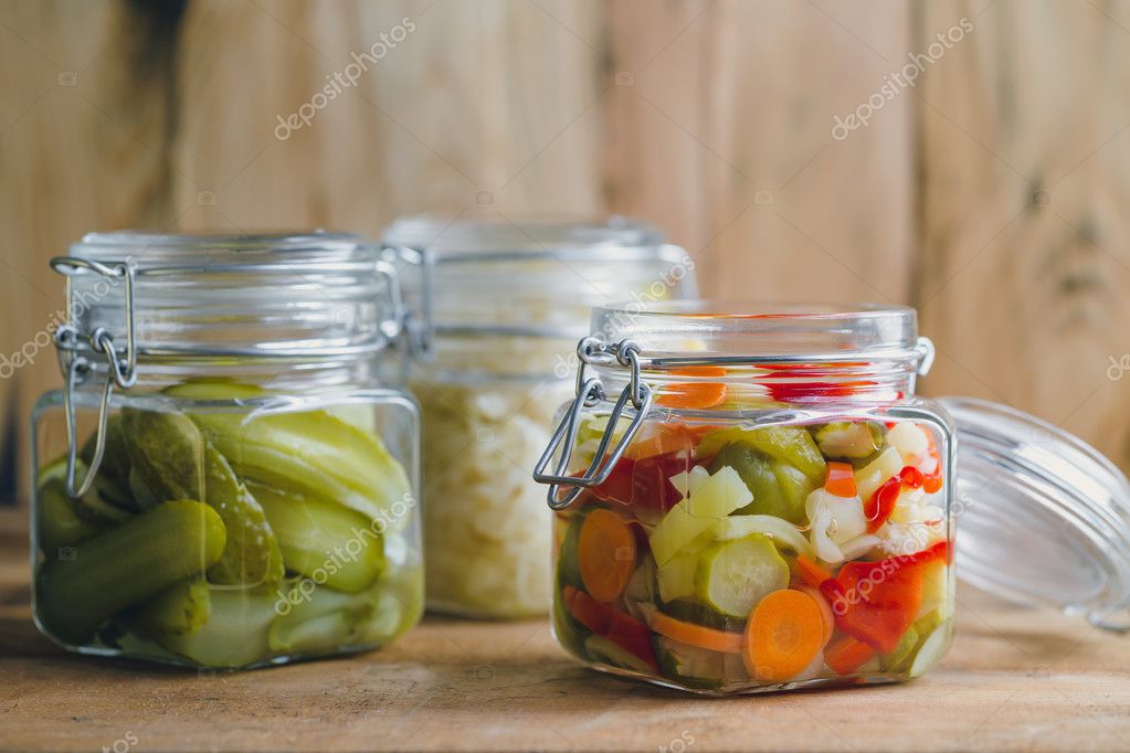 Pickled vegetables in glass jars — Stock Photo © Melica 127742152