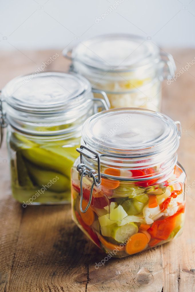 Pickled vegetables in glass jars Stock Photo by ©Melica 127742386