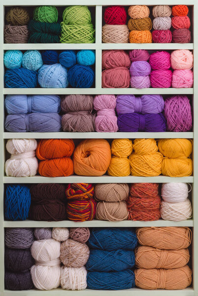Colorful Balls Of Wool On Shelves. 