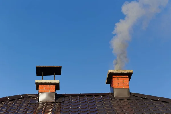 Smoke from brick chimney — Stock Photo, Image