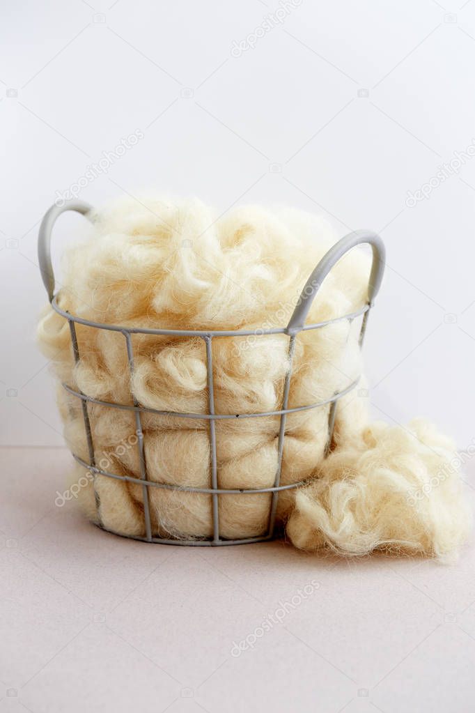 Basket of raw natural fiber
