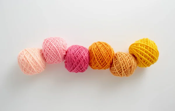 Knitting yarn balls in pink and yellow tone. — Stock Photo, Image