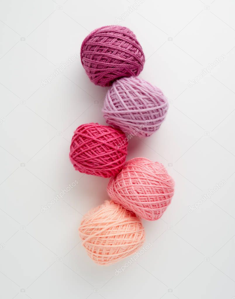 Knitting yarn balls in pink tone. 