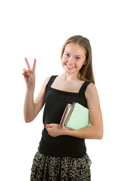 Uma menina alegre está mostrando o sinal do dedo: "Vitória " — Fotografia de Stock