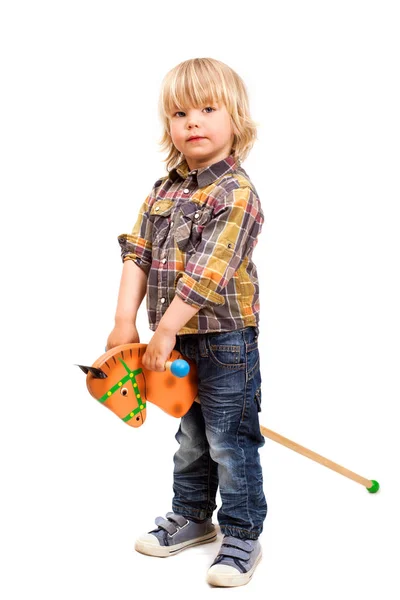 Small boy with wooden horse — Stock Photo, Image