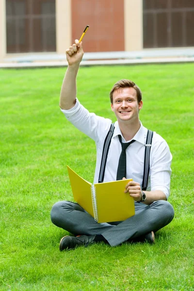 Happy businessman with notebook — Stock Photo, Image
