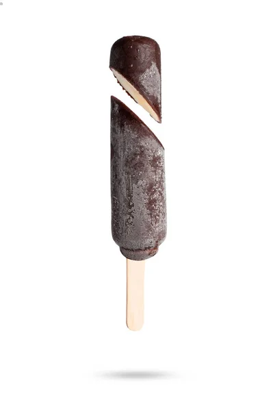 Chocolate coated ice cream in a cut on a stick on a white background — 스톡 사진