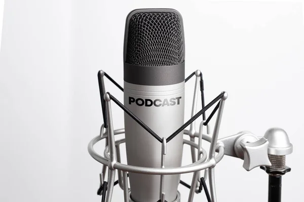 Studio microphone for recording podcasts, songs, and radio programs on a white background with a place for inscription. copyspace — Stock Photo, Image