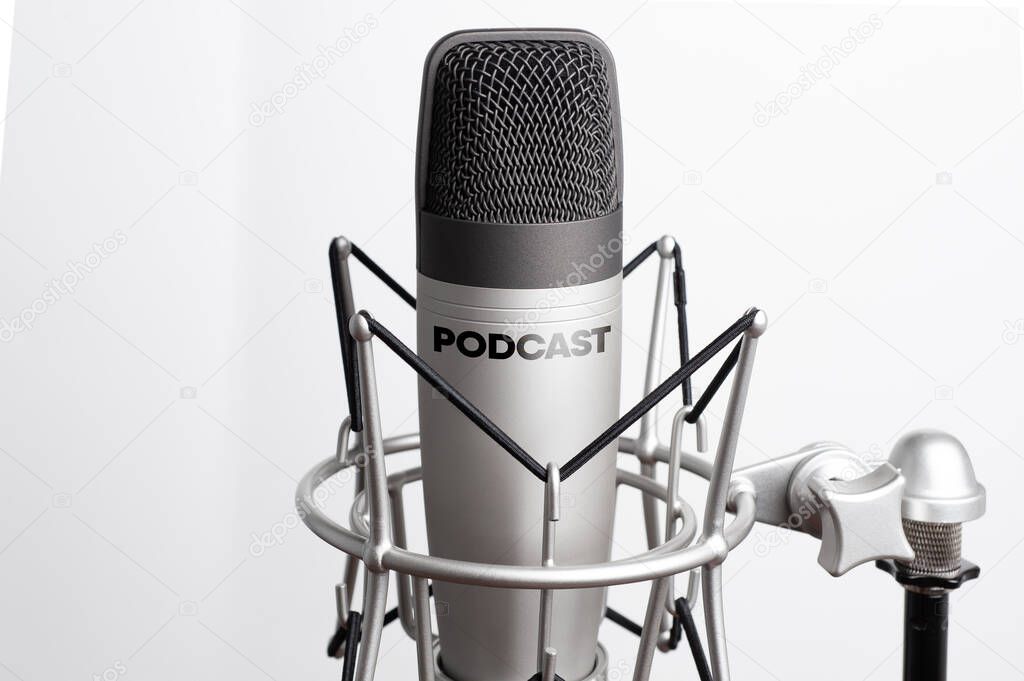  studio microphone for recording podcasts, songs, and radio programs on a white background with a place for inscription. copyspace