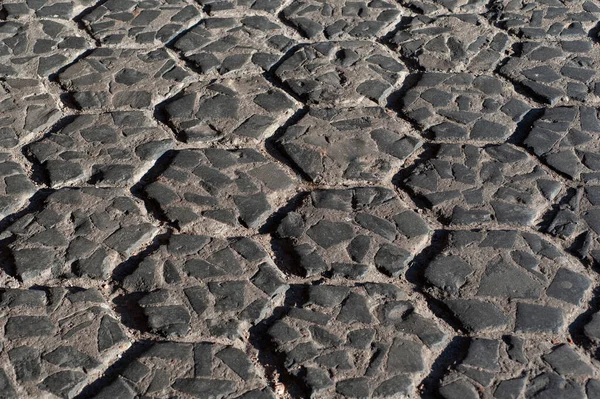 Fundo textura estrada de pedras velhas folhas em perspectiva — Fotografia de Stock