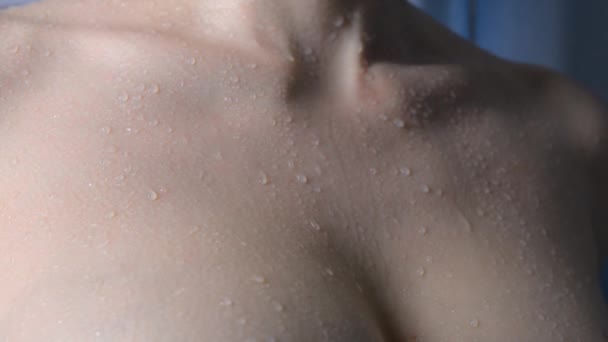 Breast and collarbone of young caucasian female water trickles run down the skin — Stock Video