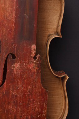 Broken antique red violin for restoration with damage clipart