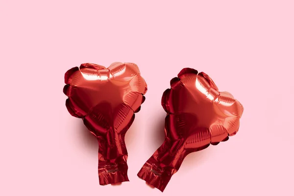 Two red foil balloon hearts on a pink background - Valentines Day card — 스톡 사진
