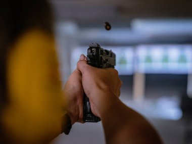 shooting a gun in a shooting range