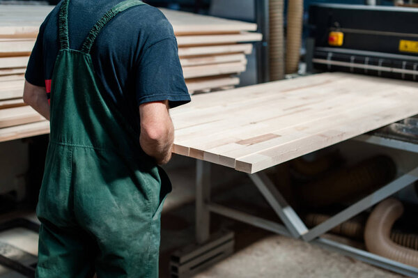 Worker in a furniture manufacture production.