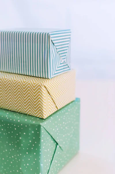 Three present boxes with modern packaging