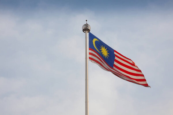 Malaysian flag flying in wind