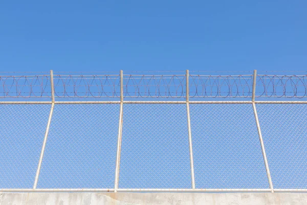 Security with a barbed wire fence — Stock Photo, Image
